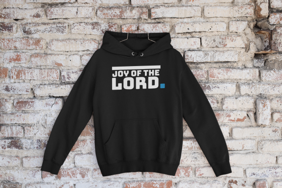 Black hoodie with the text "Joy of the Lord" printed in white.